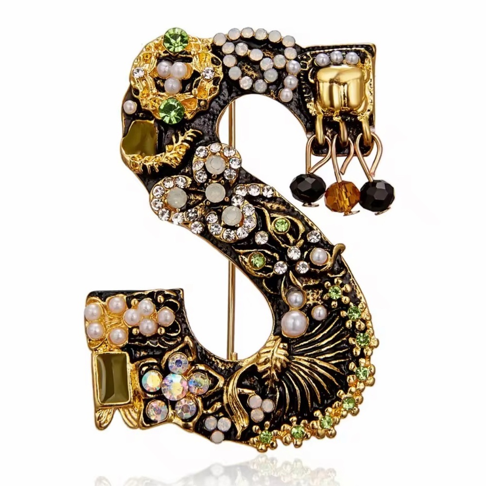 Elegant Gold and Black Brooch with Crystal Accents - Picture 1 of 6